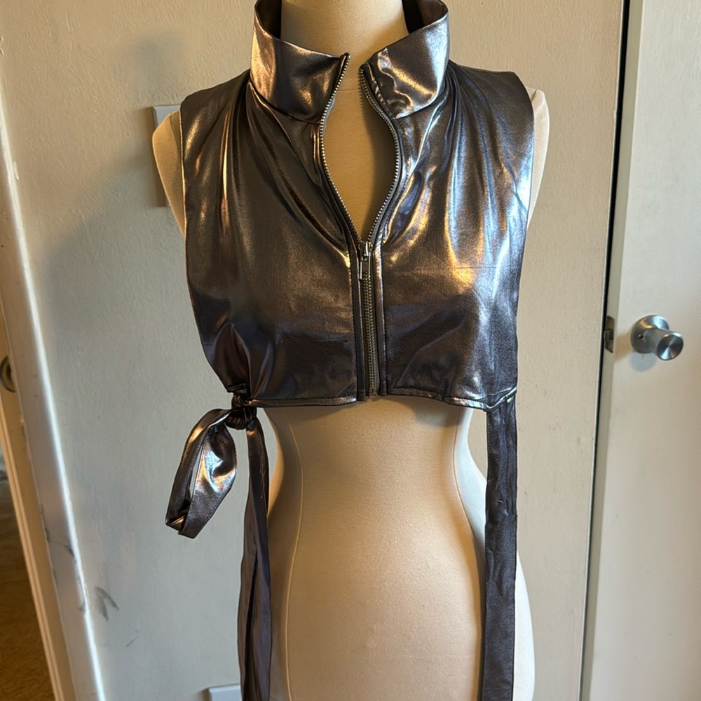 Under boob. Shirt. With sides out , you can wear it as a vest, or by itself